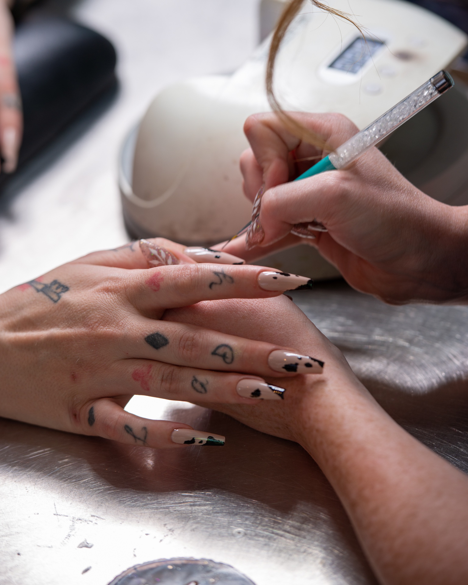 Thalia shows off chic Louis Vuitton-inspired nail art